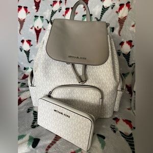 Michael Kors backpack and matching wallet.